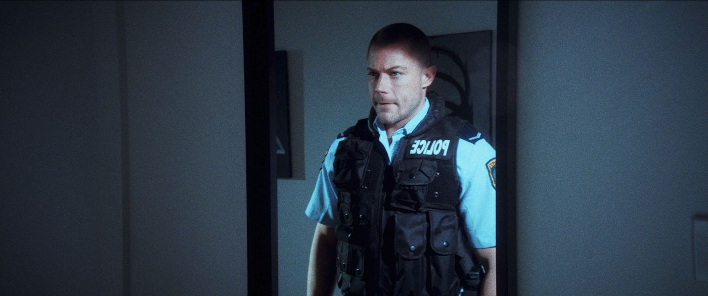 Body Blow — Aiden in police uniform, reflected in a mirror