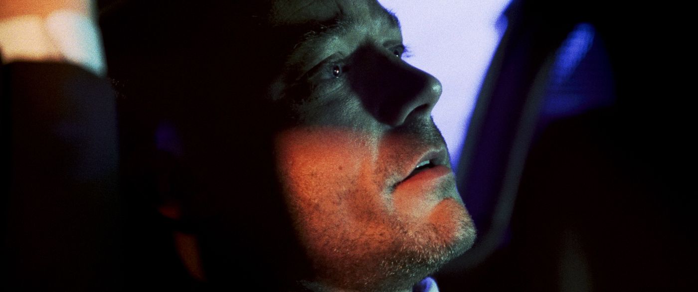 Body Blow — a close-up under orange and blue neon light