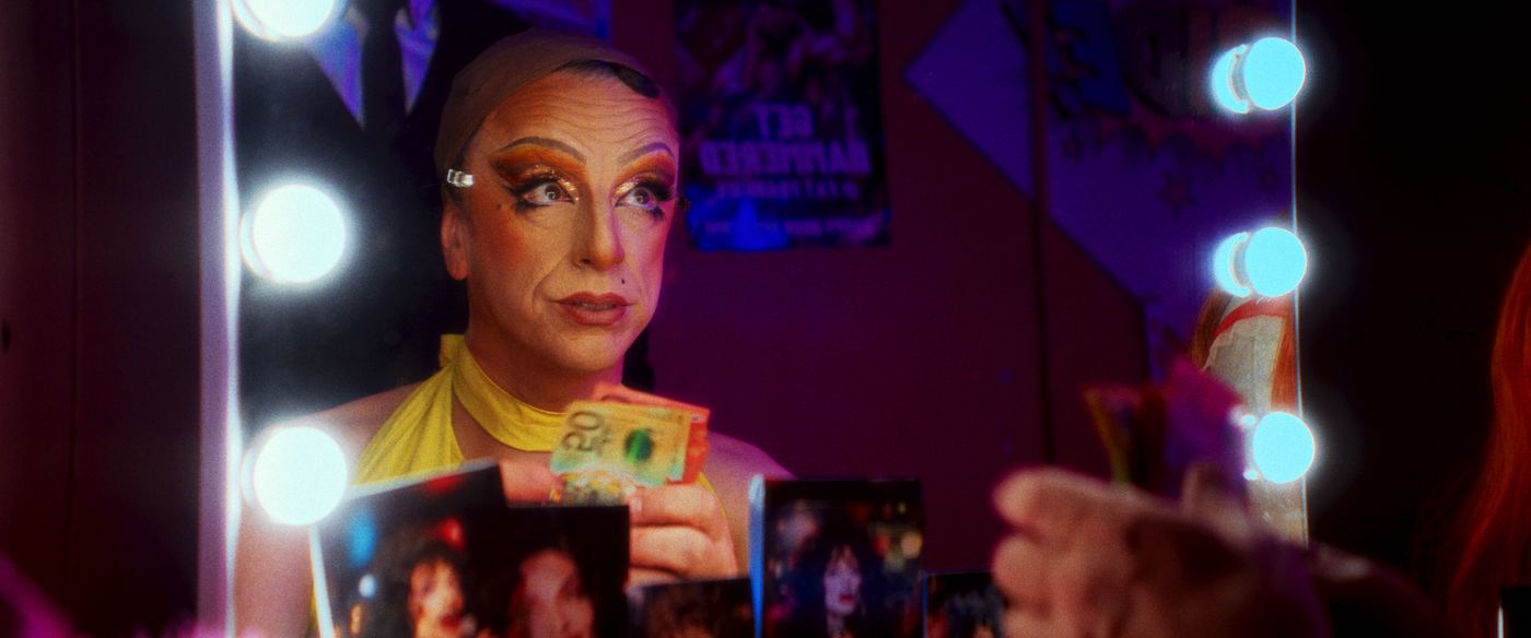 Body Blow — a drag performer backstage in neon light